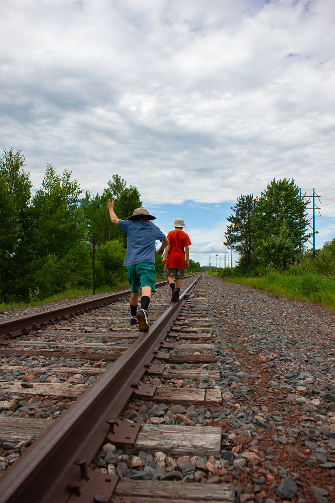 Kids on a railroad track