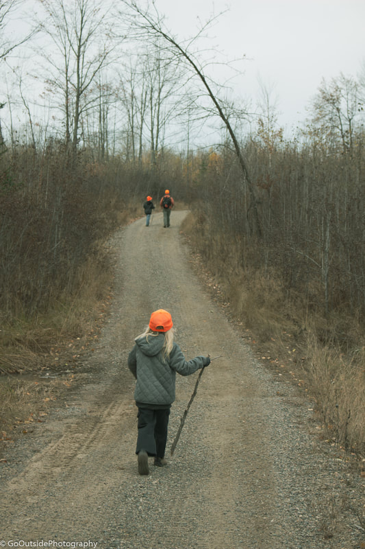 Kids and husband walking during hunting season